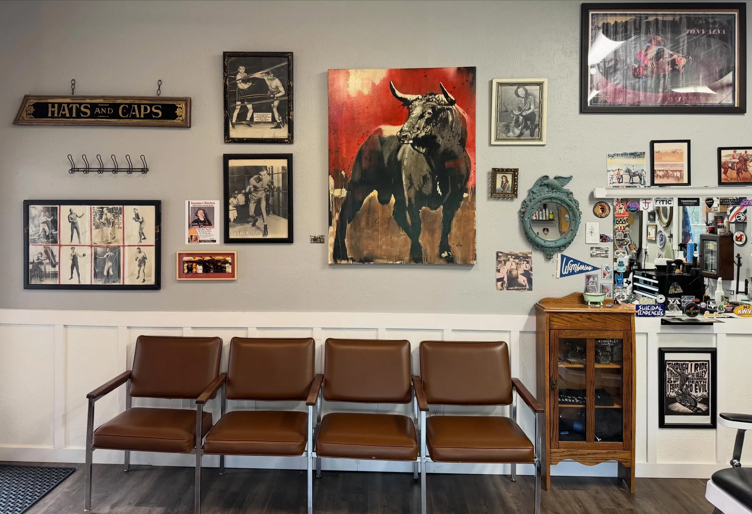 Wimberley Barber Shop waiting area with leather chairs and vintage gallery wall
